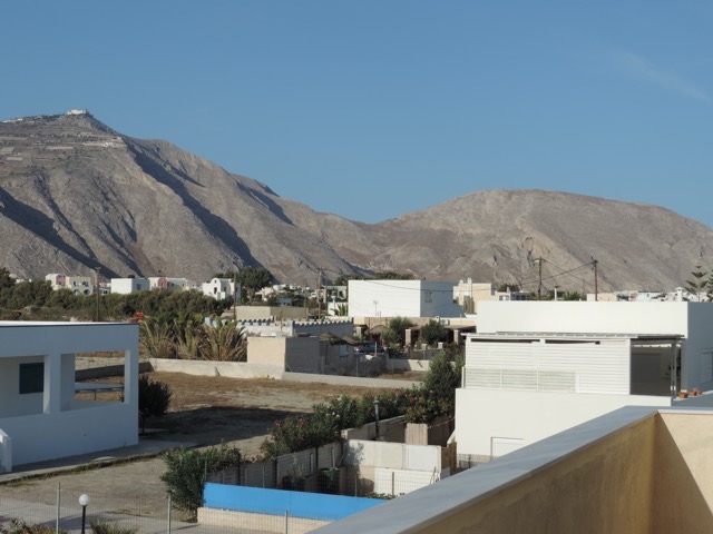 From our hotel, the highest peak on the left and old Thira on the right.