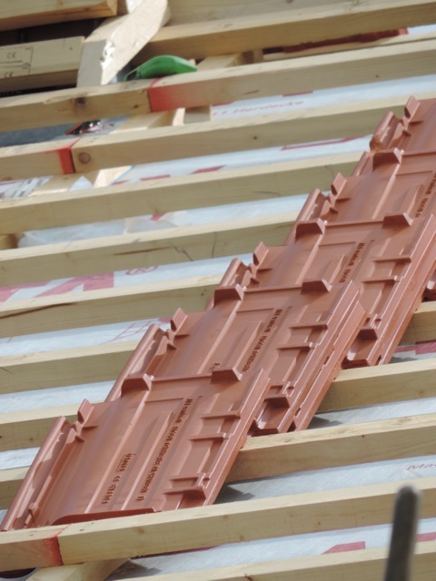 close up of the tiles that interlock and just set on the laths